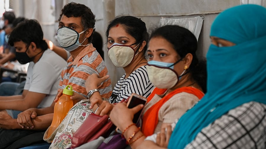 People wait in line to get inoculated with a dose of the Covid-19 coronavirus vaccine at a vaccination centre of the Rajawadi Hospital in Mumbai on May 1, 2021 during the first day of India's vaccination drive to all adults. Credit: AFP Photo