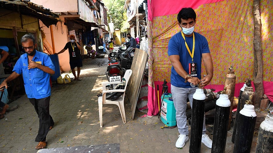 In the slums of Mumbai, Shanawaz Shaikh has provided free oxygen to thousands of people. Credit: AFP Photo