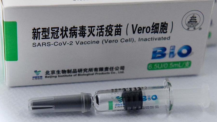 This picture shows a syringe and boxes of the Chinese Sinopharm Covid-19 vaccine during a mass vaccination campaign at the Boris Trajkovski Arena in Skopje on May 6, 2021. Credit: AFP Photo