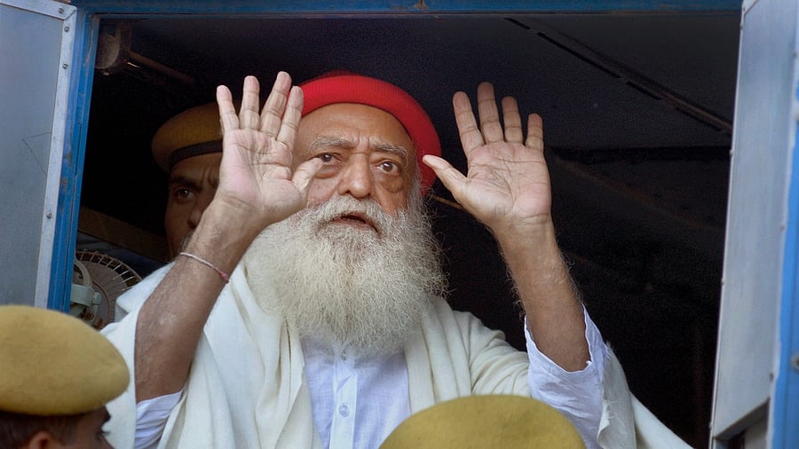 File photo of Asaram after being produced at the sessions court in Jodhpur, November 30, 2013. Credit: PTI Photo
