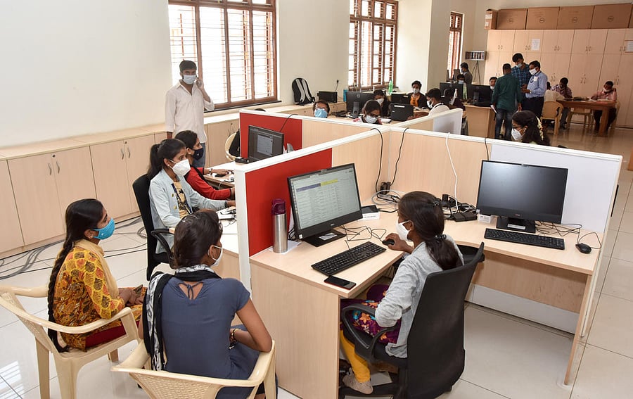 Staff carry out work at war room in Mysuru. DH Photo