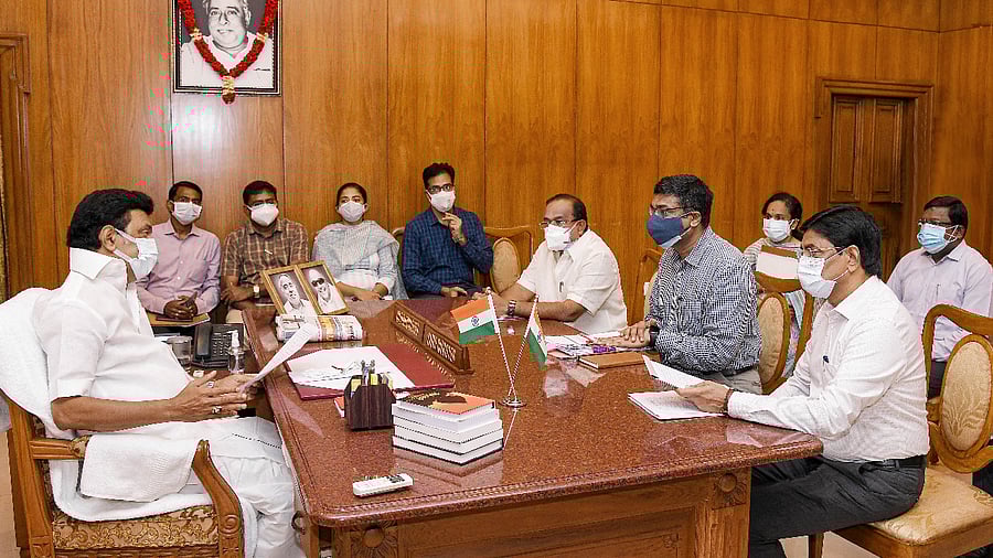 Tamil Nadu Chief Minister MK Stalin reviewing Covid-19 preventive measure with Secretaries and senior government officials at his cabin,in Chennai. Credit: PTI Photo