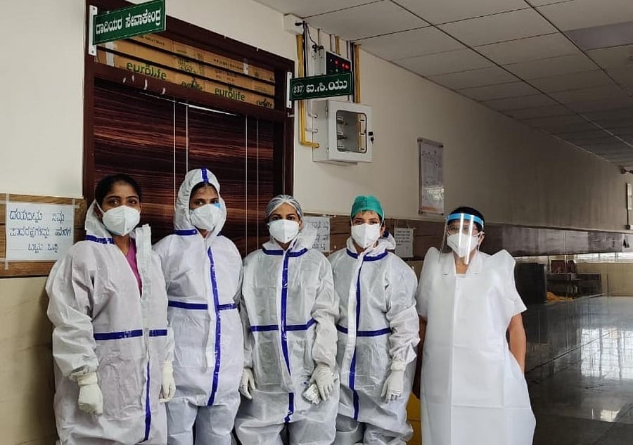 Nurses at the district hospital on Covid duty in Mysuru. DH Photo