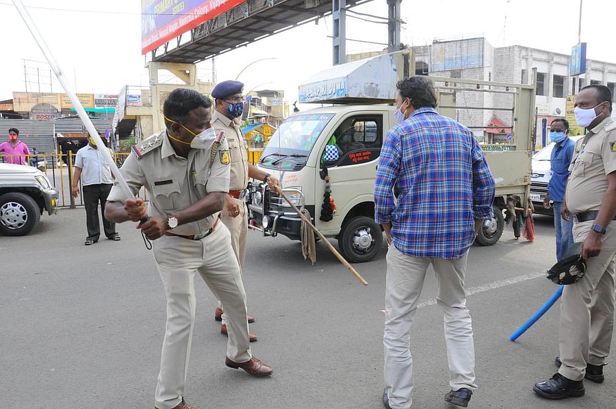 Police thrashed this man in Vijayapura on Monday. Videos of police excesses are pouring in from all parts of Karnataka, and triggering huge public outrage. Credit: DH Photo