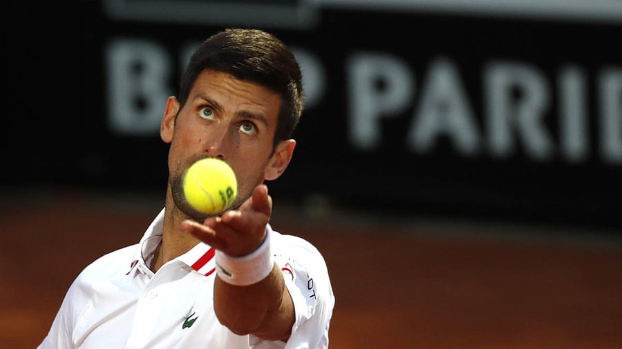 Novak Djokovic of Serbia serves the ball to Taylor Fritz of the United States during their match at the Italian Open tennis tournament, in Rome. Credit: AP Photo
