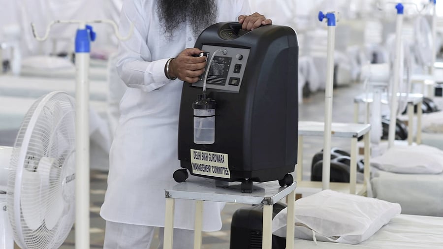 Patients with mild symptoms of Covid-19 can breathe with the help of oxygen concentrators at their home. Credit: PTI Photo