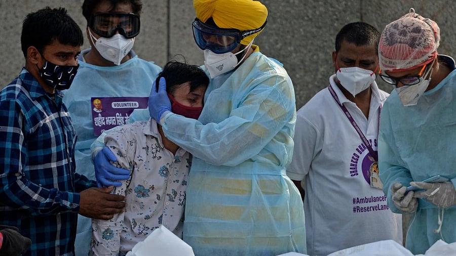 A man mourns the death of his loved one. Credit: AFP Photo