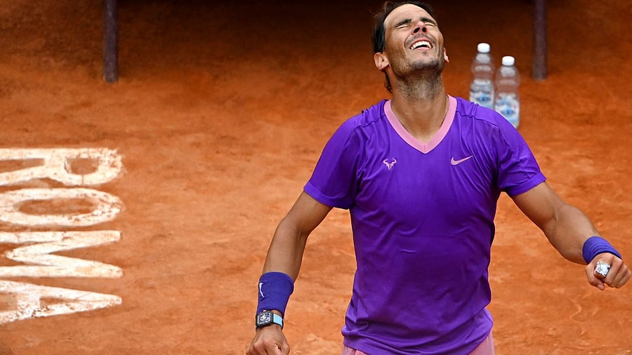 Spain's Rafael Nadal celebrates after winning his tennis match against Germany's Alexander Zverev at the Men's Italian Open at Foro Italico on May 14, 2021 in Rome, Italy. Credit: AFP Photo