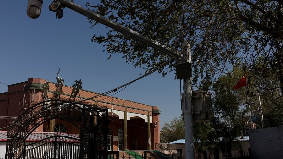 A Chinese national flag flies outside the former Xinqu Mosque that had its minarets and central dome removed. Credit: Reuters Photo