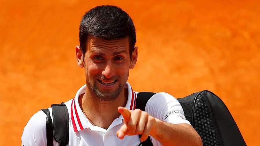 Serbia's Novak Djokovic celebrates after winning his quarter final match against Greece's Stefanos Tsitsipas. Credit: Reuters Photo