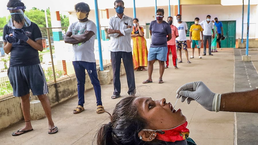 People lined up to give swab samples for Covid-19 tests, in Bengaluru, Thursday, May 13, 2021. Credit: PTI Photo