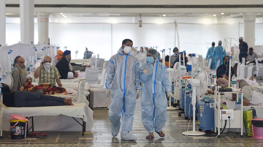 Covid-19 patients undergo treatment at Guru Tegh Bahadur Covid Care Centre at the Gurdwara Rakab Ganj Sahib, in New Delhi, Tuesday, May, 18, 2021. Credit: PTI Photo