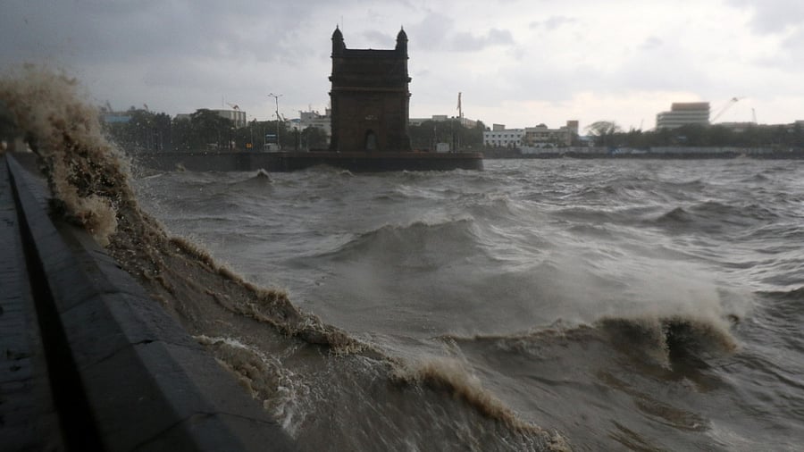 Waves caused by Cyclone Tauktae crash up on the promenade near the Gateway of India monument in Mumbai. Credit: Reuters Photo