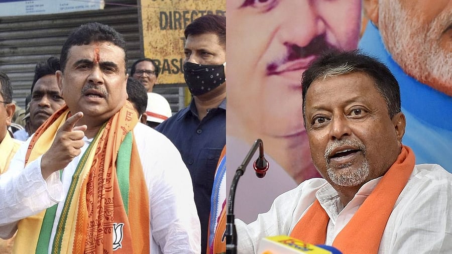 Mukul Roy and Suvendu Adhikari. Credit: PTI File Photos