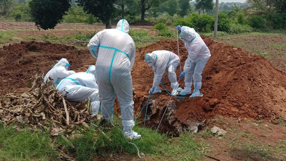 Members of Seva Bharati perform the final rites of a Covid victim in Kushalnagar.