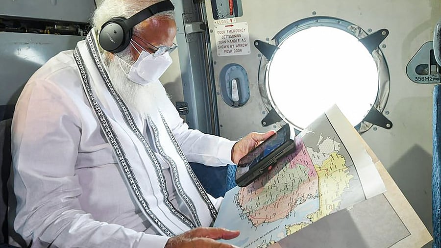 Prime Minister Narendra Modi makes an aerial survey of cyclone Tauktae affected areas of Gujarat. Credit: PTI Photo