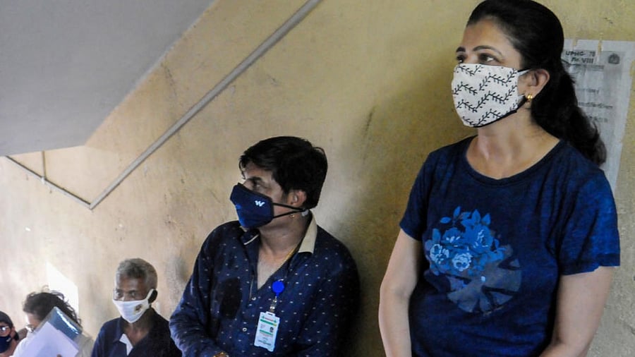 Beneficiaries wait in a queue to receive Covid-19 vaccine dose at a healthcare centre in Kolkata, Thursday, May 20, 2021. Credit: PTI Photo