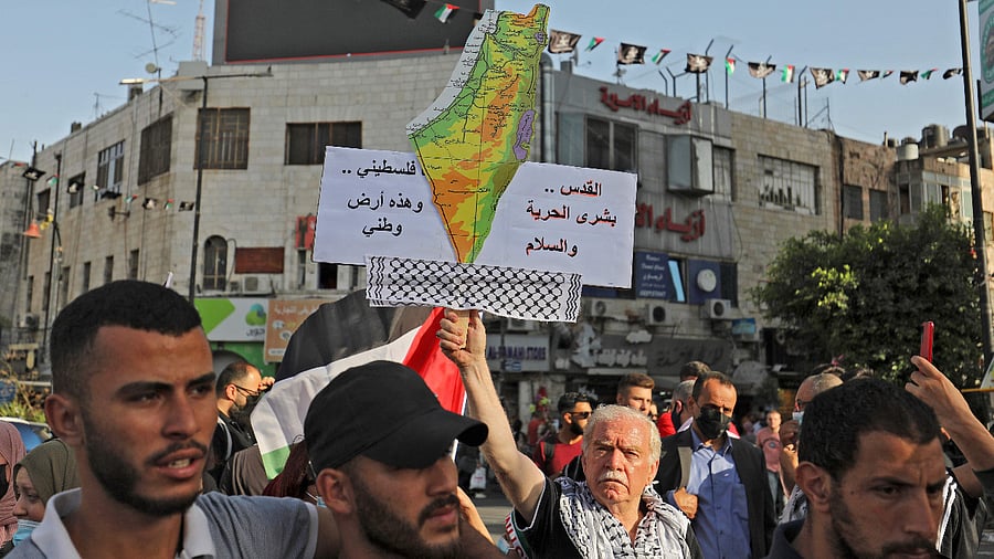 Palestinians, from Gaza and living in the West Bank, chant slogans during a demonstration in support of their relatives in Gaza. Credit: AFP Photo