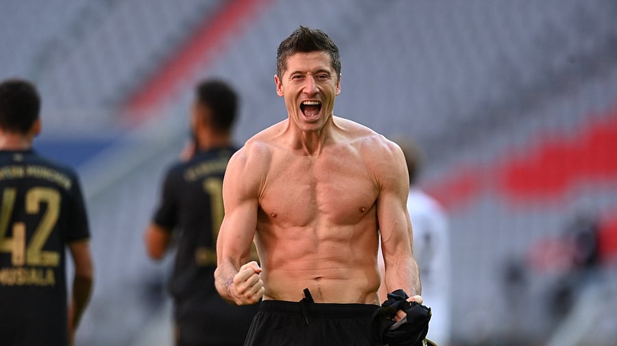Bayern Munich's Robert Lewandowski celebrates after scoring his 41st Bundesliga goal of the season in a 5-2 win over Augsburg. Credit: Reuters Photo