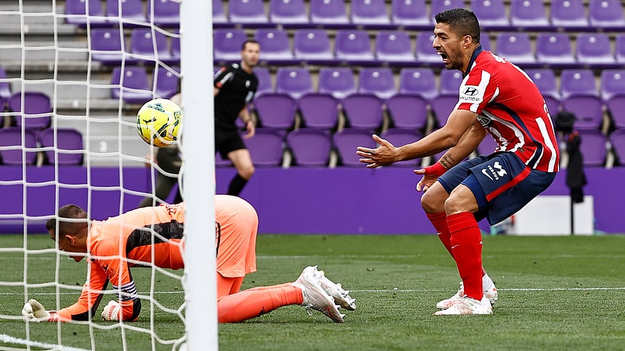 Atletico Madrid's Luis Suarez celebrates after Angel Correa scored their first goal. Credit: Reuters Photo