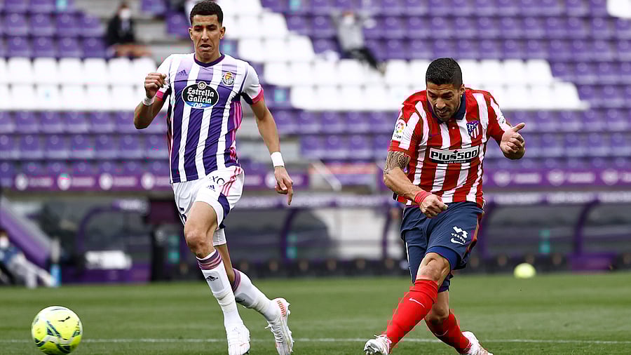Atletico Madrid's Luis Suarez scores their second goal. Credit: Reuters Photo