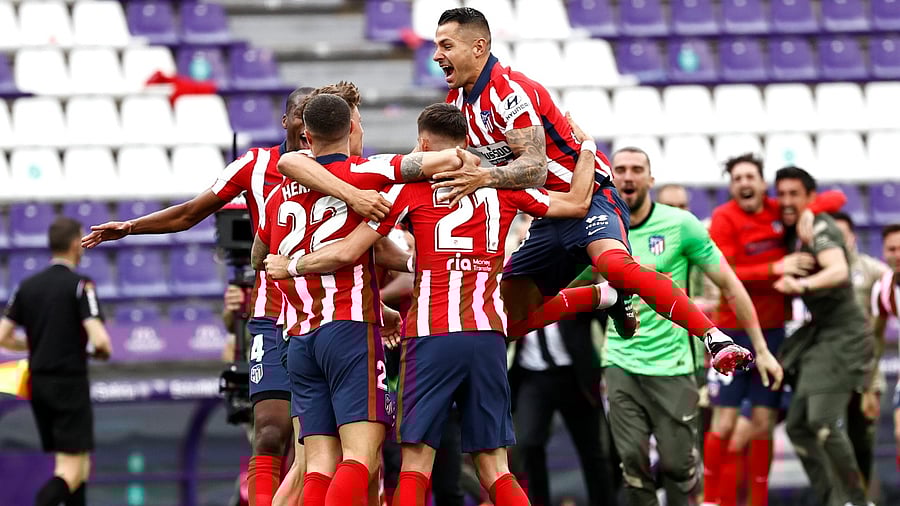 Some Atletico players piled onto each other and others fell to the ground with exhaustion and relief. Credit: Reuters Photo