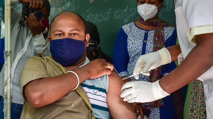 A medical worker inoculates a dose of the Covid-19 vaccine to frontline workers in Bengaluru. Credit: PTI Photo