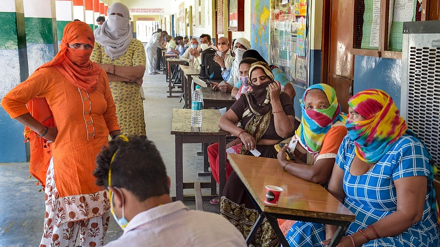 Beneficiaries wait to receive their Covid-19 vaccine doses, at a vaccination centre, Bhondsi, in Gurugram, Tuesday, May 25, 2021. Credit: PTI Photo