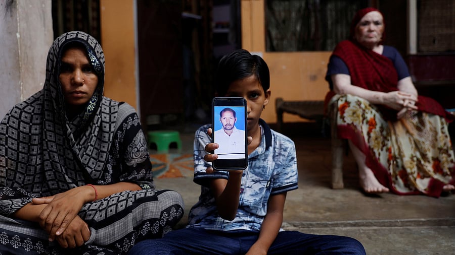 Picture of a non-teaching staff who was posted on election duty on a mobile phone inside their house in the town of Jewar in Gautam Buddha Nagar. Credit: Reuters Photo