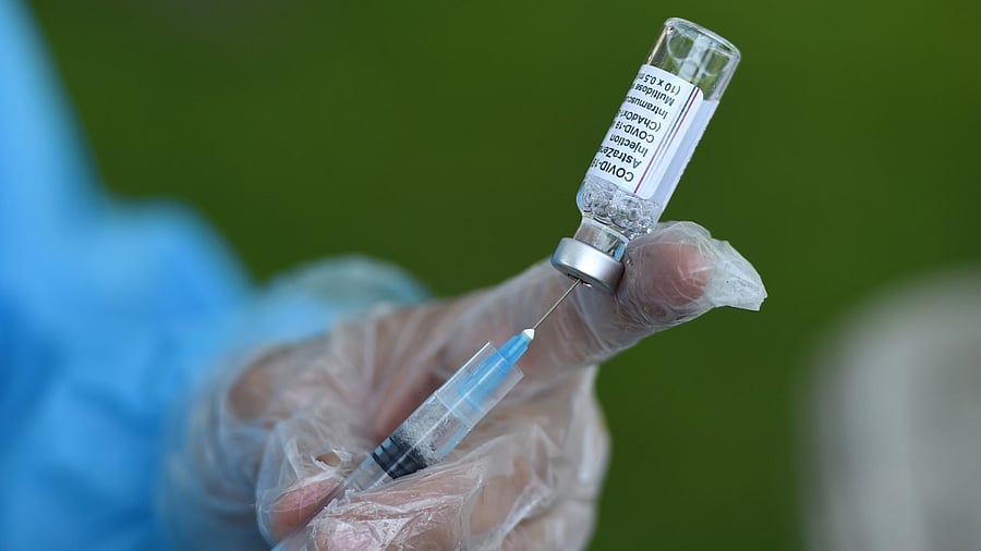 A medic prepares a dose of the Covid-19 vaccine before inoculating a beneficiary. Credit: PTI Photo