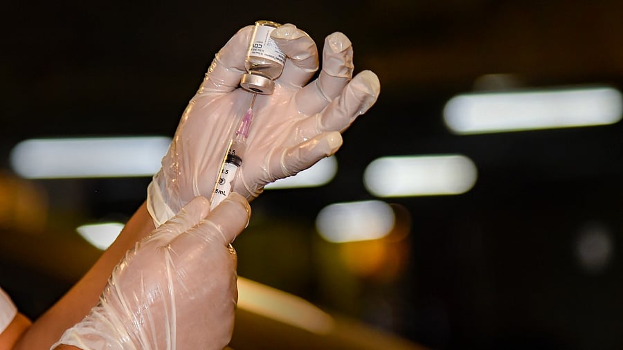  A health worker prepares a dose of the Covid-19 vaccine. Credit: PTI Photo