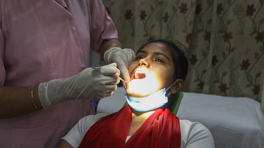 A doctor checks a patient for mucormycosis symptoms or black fungus, at a hospital in Prayagraj, May 28, 2021. Credit: PTI Photo