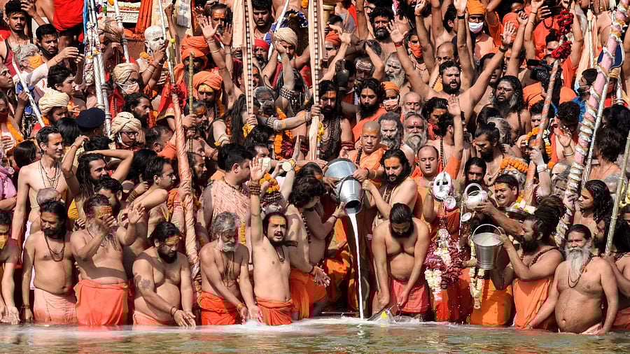 Devotees gather to offer prayers during the third 'Shahi Snan' of the Kumbh Mela 2021, at Har ki Pauri Ghat in Haridwar. Credit: PTI File Photo
