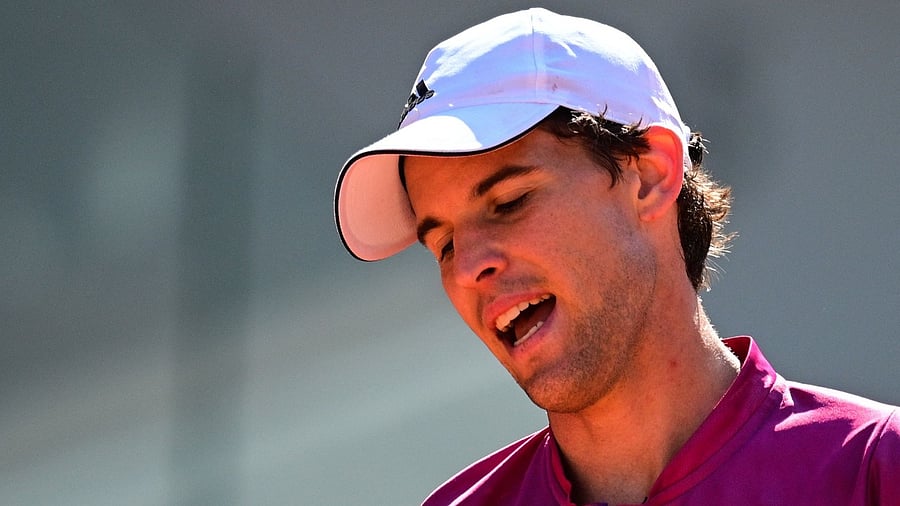 Austria's Dominic Thiem reacts as he returns the ball to Spain's Pablo Andujar during their men's singles first round tennis match on Day 1 of The Roland Garros 2021 French Open tennis tournament in Paris on May 30, 2021. Credit: AFP Photo