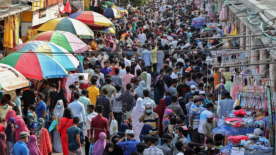 Shoppers crowd at a marketplace in Dhaka, Bangladesh. Credit: AFP File photo