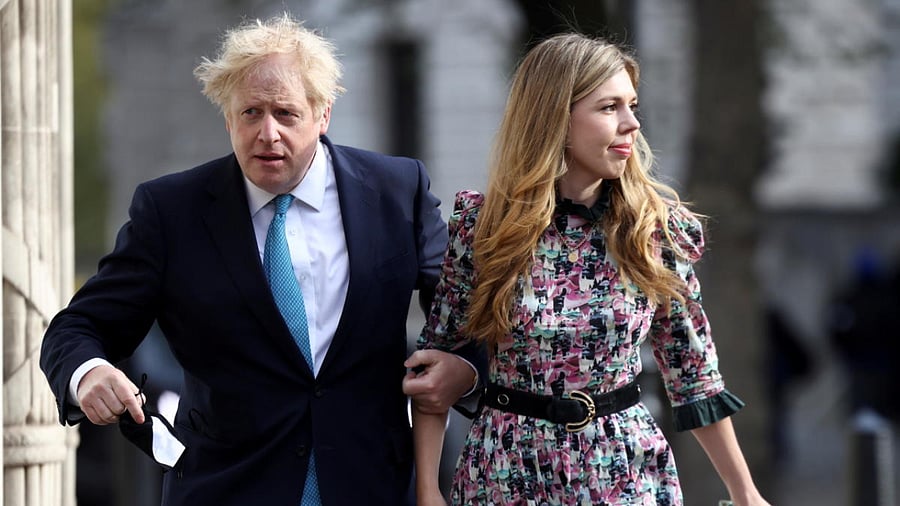 Britain's Prime Minister Boris Johnson and partner Carrie Symonds. Credit: Reuters File Photo