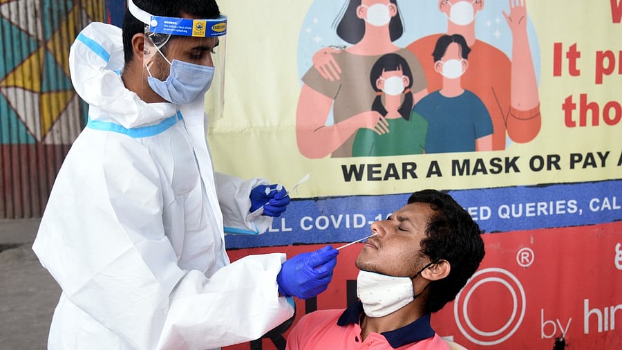 1,38,809 tests were done on Sunday, including 1,24,232 using RT-PCR tests. Credit: DH Photo/S K Dinesh