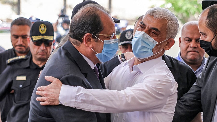 Yahya Sinwar (L), Hamas' political chief in Gaza, embraces General Abbas Kamel (R), Egypt's intelligence chief. Credit: AFP Photo