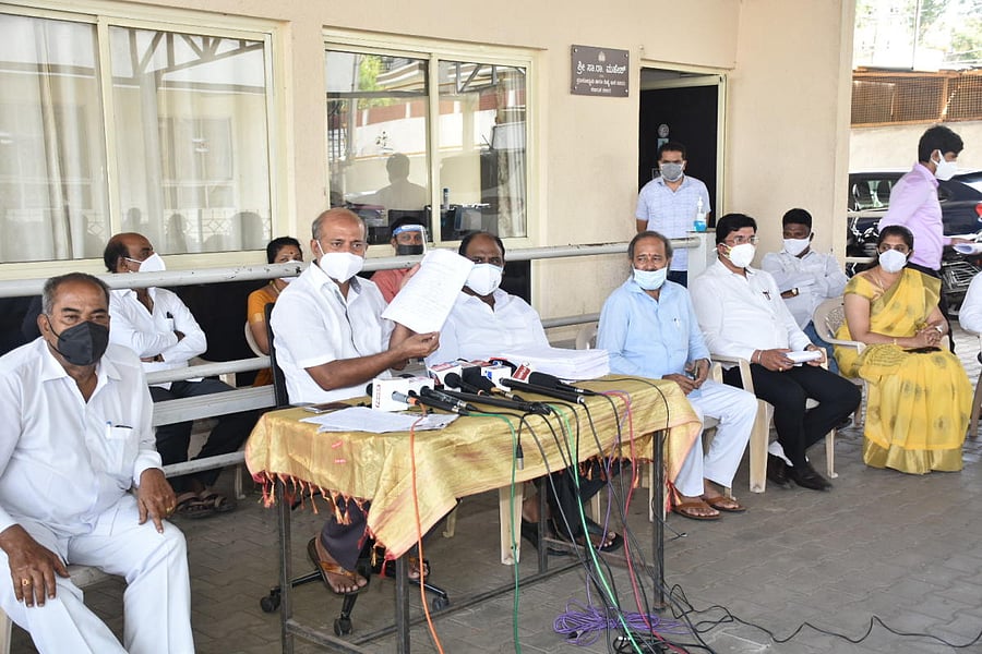 MLA Sa Ra Mahesh displays documents of Covid deaths at his office in Mysuru on Monday. DH PHOTO