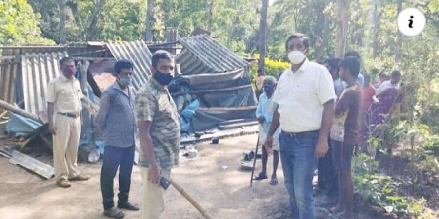 Forest department officials inspect the damaged house of the couple at Balegundi in Vallur.
