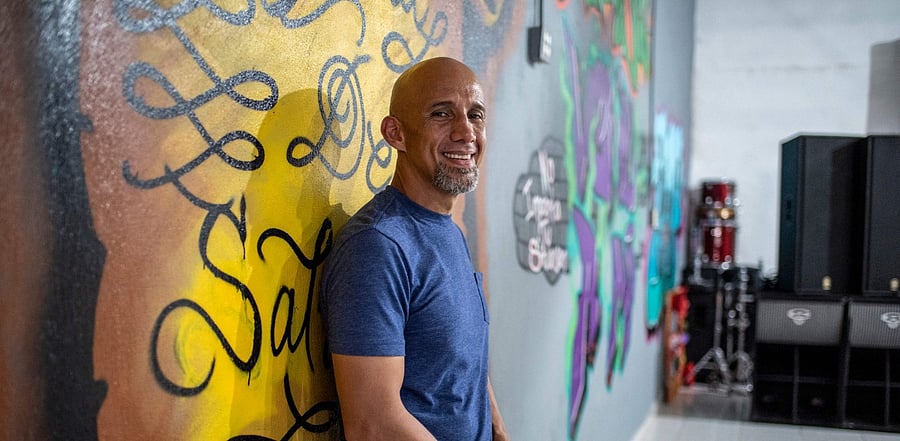 Pastor Abraham Barberi poses for a portrait inside his church. Credit: AFP Photo