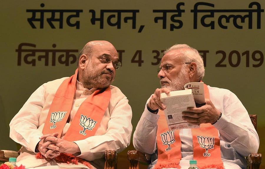 Minister of Home Affairs Amit Shah, Prime Minister Narendra Modi. Credit: PTI Photo