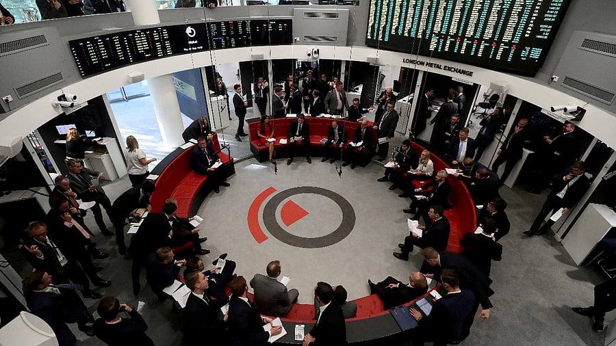 raders work on the floor of the London Metal Exchange. Credit: Reuters Photo