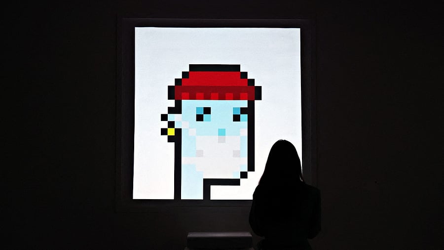 nyone can view the artworks the NFTs represent, but only the buyer has the official status of being the owner. Credit: AFP Photo