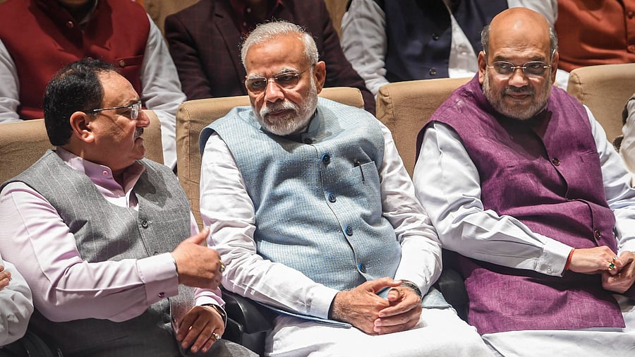 BJP National President JP Nadda (L), Prime Minister Narendra Modi (center), Union Home Minister Amit Shah. Credit: PTI File Photo
