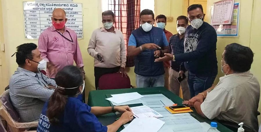 Activists and the public urge officials not to hand over Covid Care Centre to private management in Somwarpet.