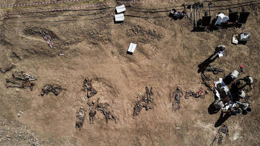 The remains of up to 12,000 people are believed to be buried in these graves. Credit: AFP Photo