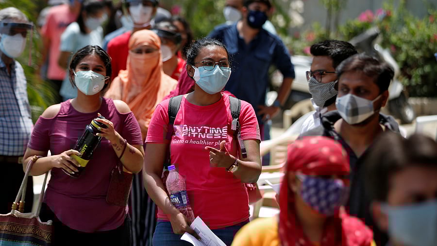 Videos and images of serpentine queues at metro stations and over-crowded markets and malls in the national capital have made it to social media. Credit: Reuters Photo