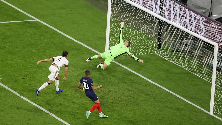 Germany's defender Mats Hummels (L) deflects the ball to score past Germany's goalkeeper Manuel Neuer for the first goal during the UEFA EURO 2020 Group F football match. Credit: AFP Photo