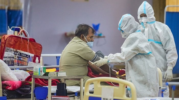 Bengaluru Urban district topped the list of positive cases with a total of 12,00,754 cases. Credit: PTI Photo